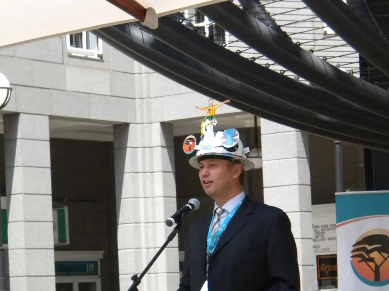 In the middle of this image there is a man wearing a suit, hat on the head, standing in front of...