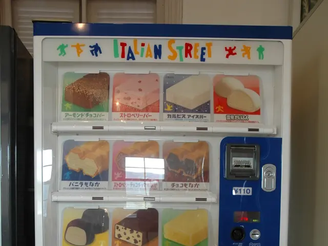 There is vending machine over here, with a lot of snacks in it. It is operated by giving money in...