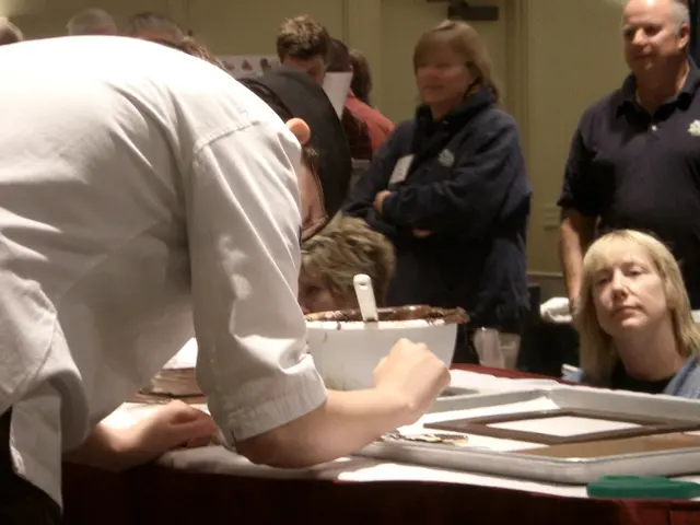 This picture describes about group of people in front of them we can find a spoon, bowl and a tray...